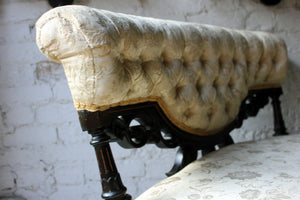 An Elegant Aesthetic Movement Ebonised Upholstered Occasional Settee